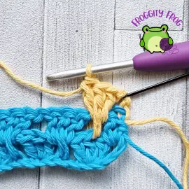 The first spiked granny stitch of row 3