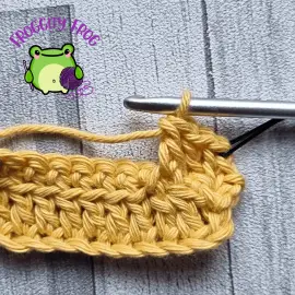 Extended double crochet in the unused loop 2 rows below