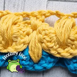 Make 2 dc in the top of the puff of the Nest stitch