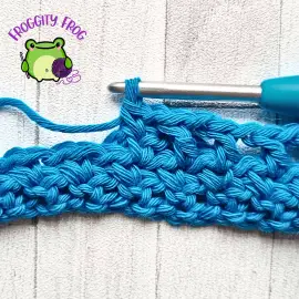 Making the dc in row 4 of the Wishbone stitch