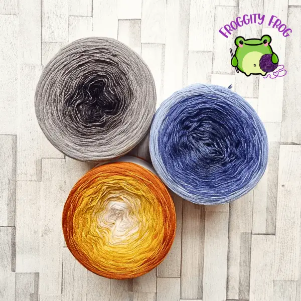 The 3 Merino ombre yarn cakes form yarn Shop By Stay Alive to make the Cobbled Road Blanket